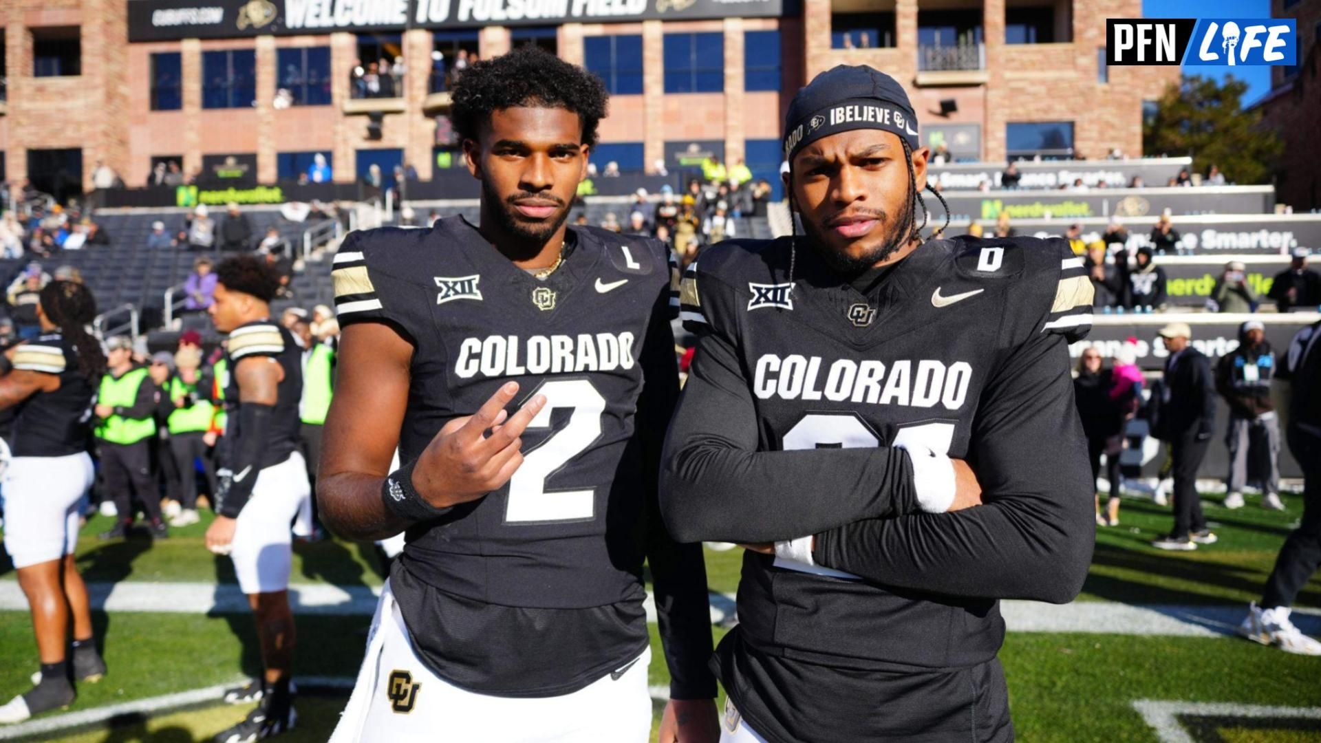 Colorado Buffaloes quarterback Shedeur Sanders (2) and safety Shilo Sanders (21) pose for a photo before the game against the Oklahoma State Cowboys at Folsom Field.