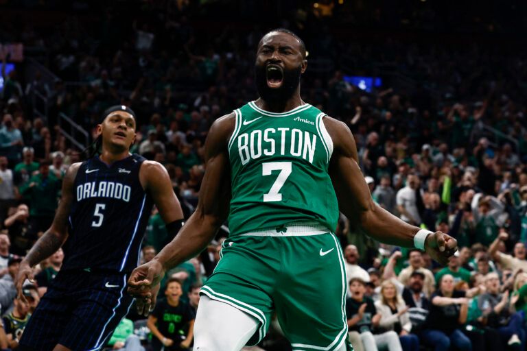 Apr 23, 2025; Boston, Massachusetts, USA; Boston Celtics guard Jaylen Brown (7) shouts out after dunking as Orlando Magic forward Paolo Banchero (5) turns away during the second half of game two of the first round of the 2024 NBA Playoffs at TD Garden. Mandatory Credit: Winslow Townson-Imagn Images