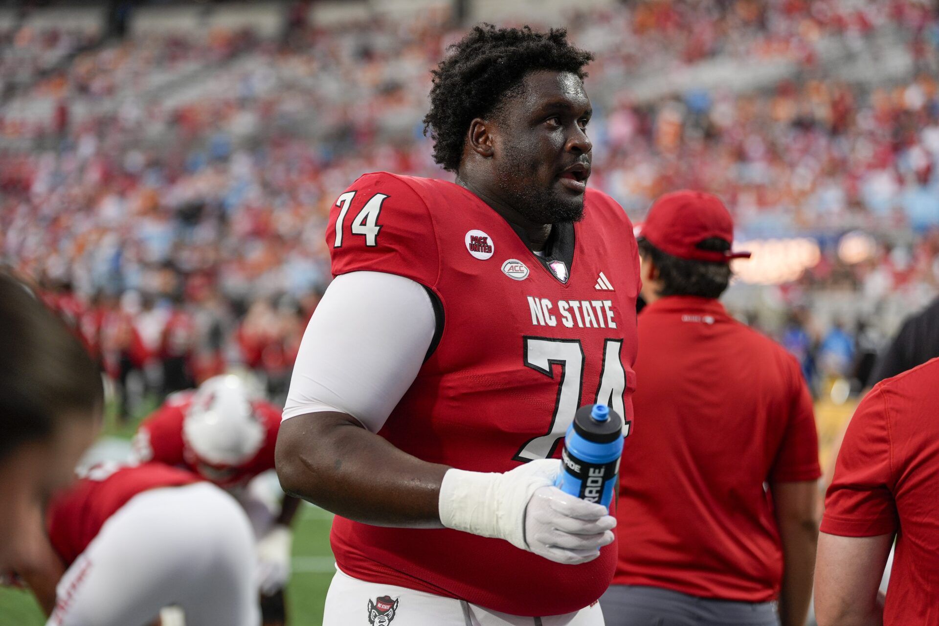 Sep 7, 2024; Charlotte, North Carolina, USA; North Carolina State Wolfpack offensive tackle Anthony Belton (74) during pregame activities against the Tennessee Volunteers at the Dukes Mayo Classic at Bank of America Stadium. Mandatory Credit: Jim Dedmon-Imagn Images