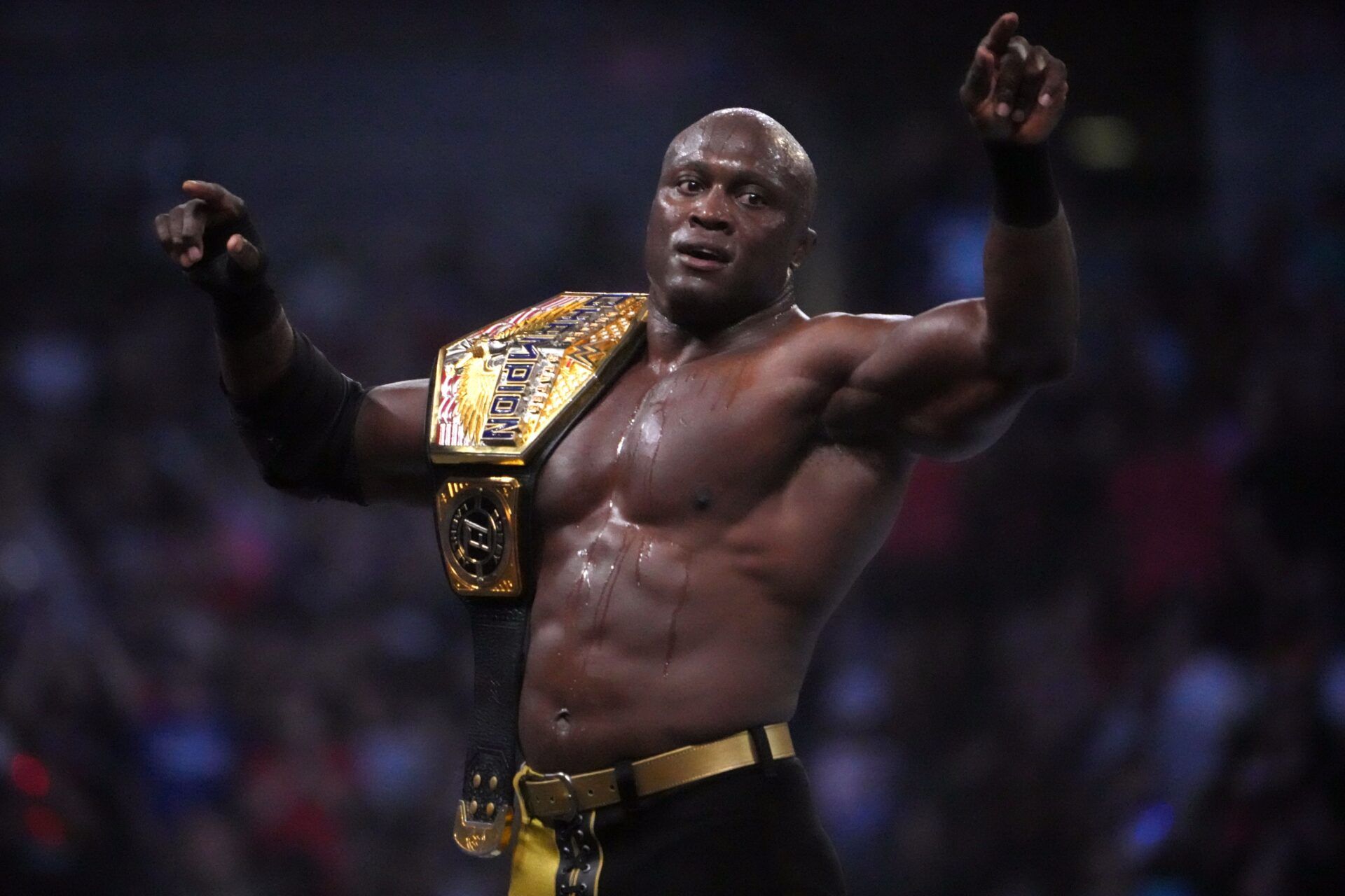 Bobby Lashley (black/gold attire) wrestles for the United States Championship during SummerSlam at Nissan Stadium