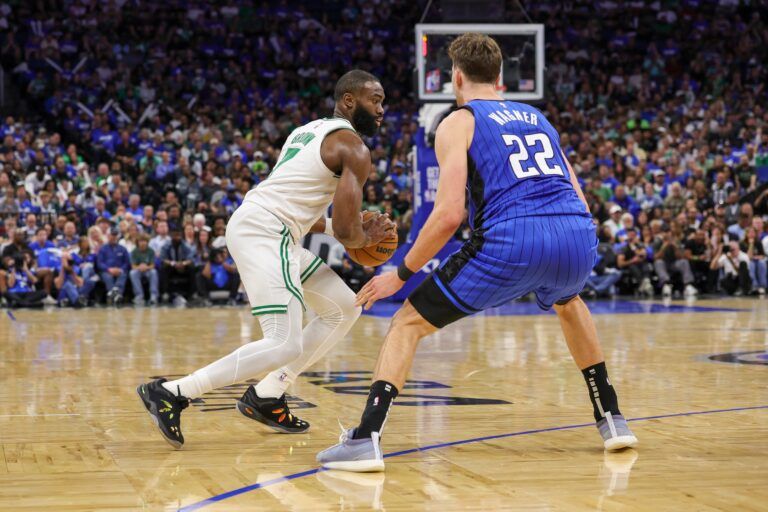Boston Celtics guard Jaylen Brown (7) moves the ball in front of Orlando Magic forward Franz Wagner (22) during the second half of game three of first round for the 2024 NBA Playoffs at Kia Center.
