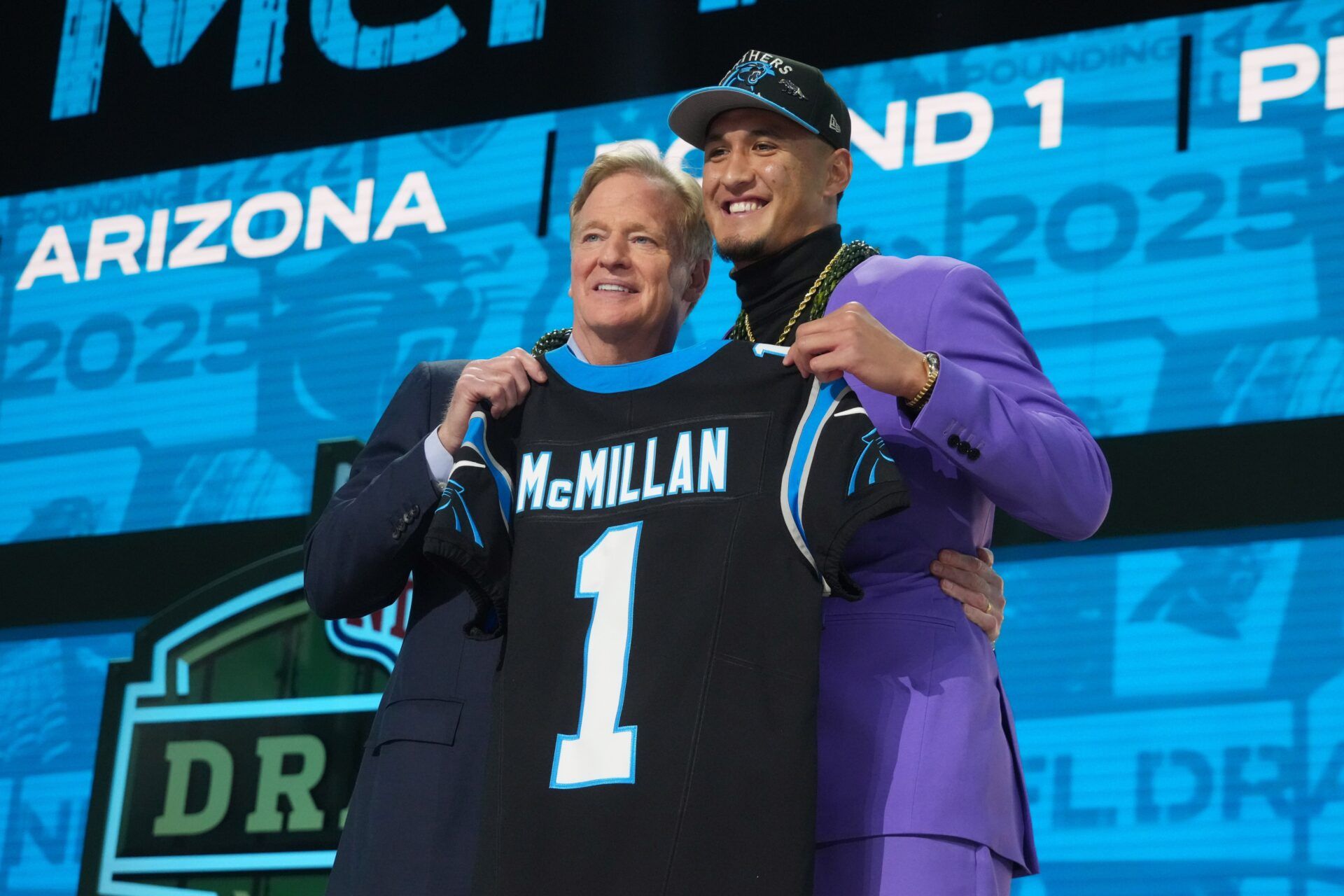 NFL commissioner Roger Goodell with Arizona Wildcats wide receiver Tetairoa McMillan after he is selected by the Carolina Panthers as the number eight pick  in the first round of the 2025 NFL Draft at Lambeau Field.