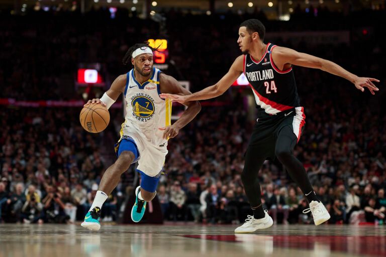 Apr 11, 2025; Portland, Oregon, USA; Golden State Warriors guard Buddy Hield (7) drives to the basket during the second half against Portland Trail Blazers forward Kris Murray (24) at Moda Center. Mandatory Credit: Troy Wayrynen-Imagn Images