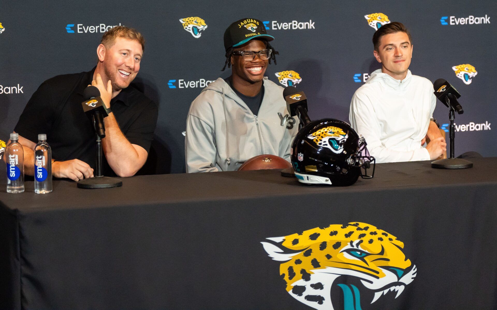 Jacksonville Jaguars ead Coach Liam Coen, left, has a laugh with Jacksonville Jaguars’ first-round pick, Colorado Buffaloes wide receiver and defensive back Travis Hunter, center, during a press conference Friday, March 25, 2025 at Miller Electric Center in Jacksonville, Fla. with General Manager James Gladstone, right. [Doug Engle/Florida Times-Union]
