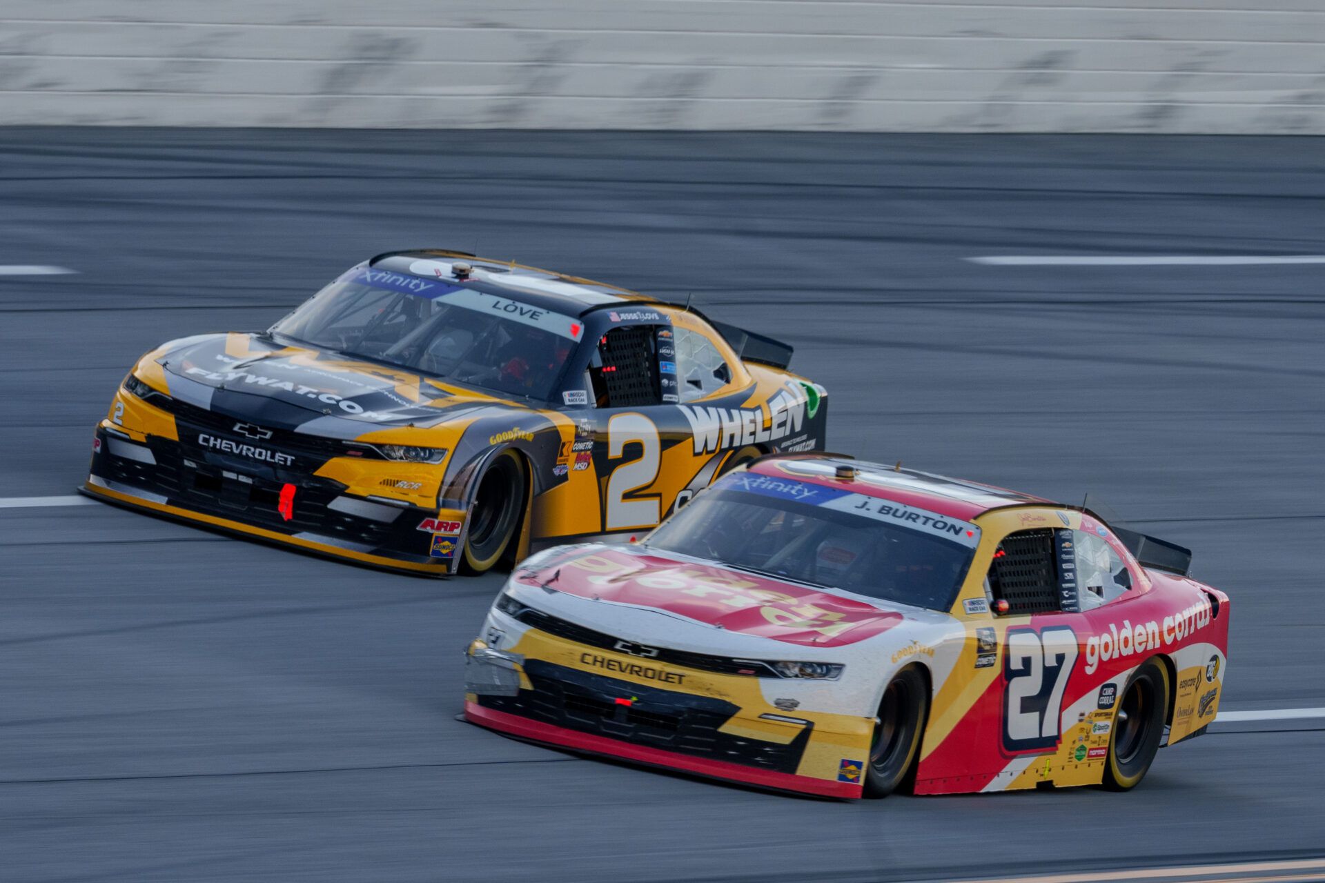 Apr 26, 2025; Talladega, Alabama, USA; Xfinity Series driver Jesse Love (2) and Xfinity Series driver Jeb Burton (27) fight going into turn one at Talladega Superspeedway. Mandatory Credit: Jason Allen-Imagn Images