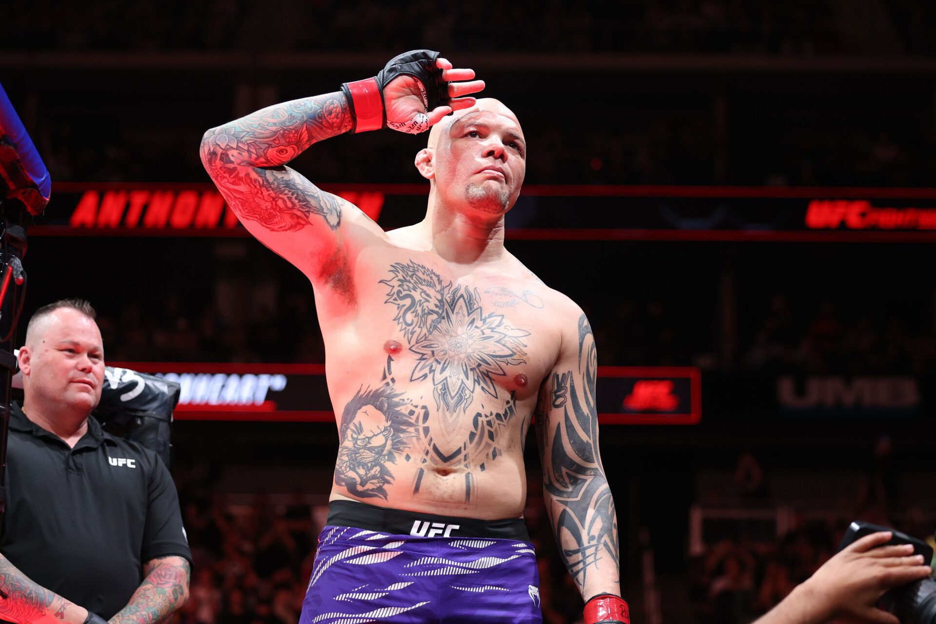 Apr 26, 2025; Kansas City, Missouri, UNITED STATES; Anthony Smith (red gloves) prepares to fight Zhang Mingyang (not pictured) during UFC Fight Night at T-Mobile Center. Mandatory Credit: William Purnell-Imagn Images