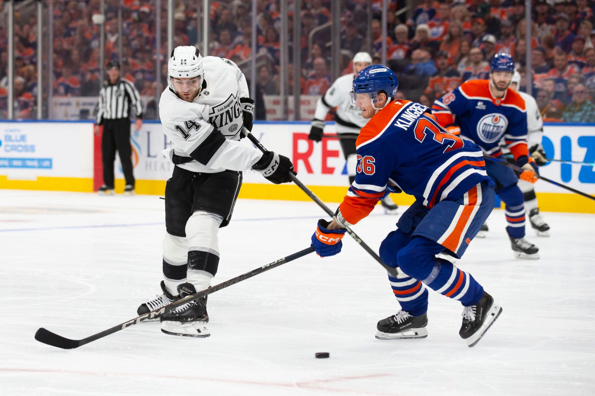 EDMONTON, CANADA - APRIL 25: John Klingberg #36 of the Edmonton Oilers defends against Alex Laferriere #14 of the Los Angeles Kings during the first period in Game Three of the First Round of the 2025 Stanley Cup Playoffs at Rogers Place on April 25, 2025, in Edmonton, Canada. (Photo by Codie McLachlan/Getty Images)