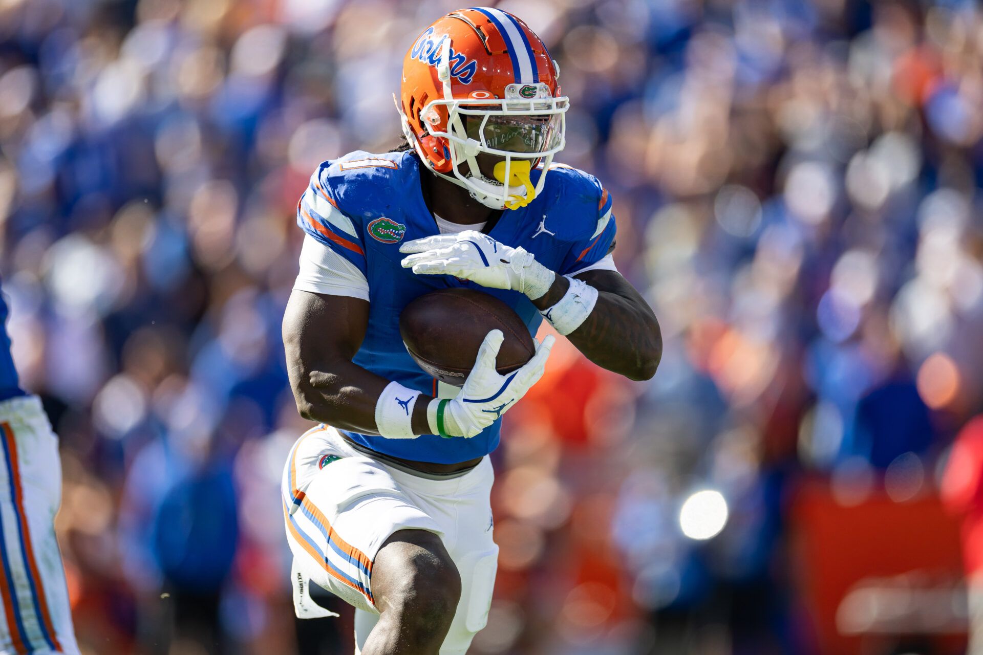 Nov 23, 2024; Gainesville, Florida, USA; Florida Gators running back Montrell Johnson Jr. (1) rushes with the ball against the Mississippi Rebels during the first half at Ben Hill Griffin Stadium. Mandatory Credit: Matt Pendleton-Imagn Images