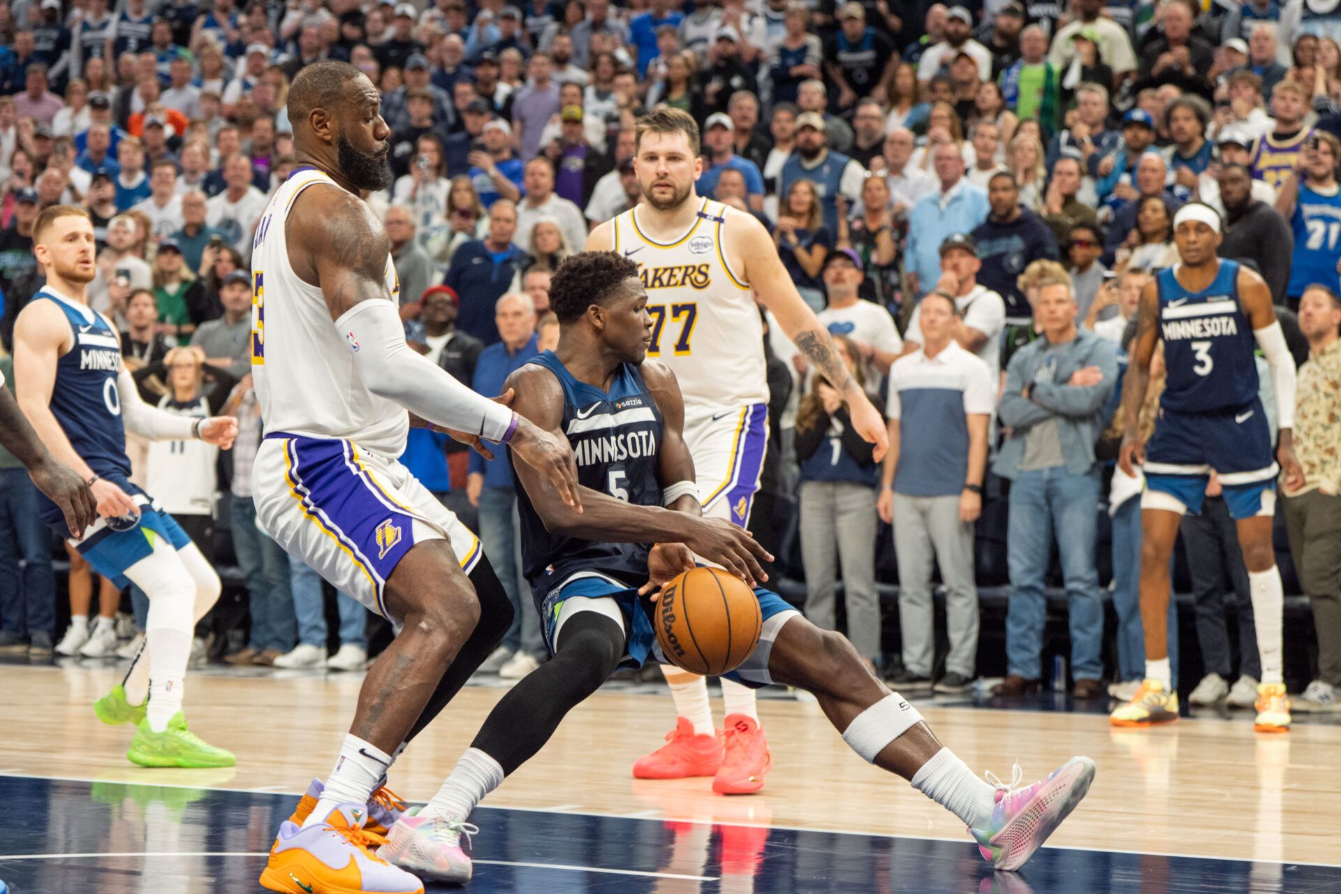 Apr 27, 2025; Minneapolis, Minnesota, USA; Minnesota Timberwolves guard Anthony Edwards (5) is fouled by Los Angeles Lakers forward LeBron James (23) in the fourth quarter during game four of first round for the 2025 NBA Playoffs at Target Center. Mandatory Credit: Matt Blewett-Imagn Images