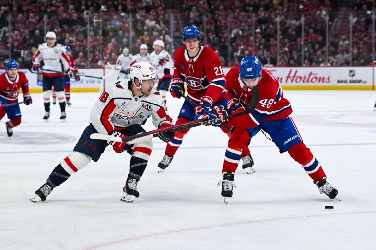 Apr 27, 2025; Montreal, Quebec, CAN; Montreal Canadiens defenseman Lane Hutson (48) defends the puck against Washington Capitals left wing Andrew Mangiapane (88) during the second period in game four of the first round of the 2025 Stanley Cup Playoffs at Bell Centre. Mandatory Credit: David Kirouac-Imagn Images