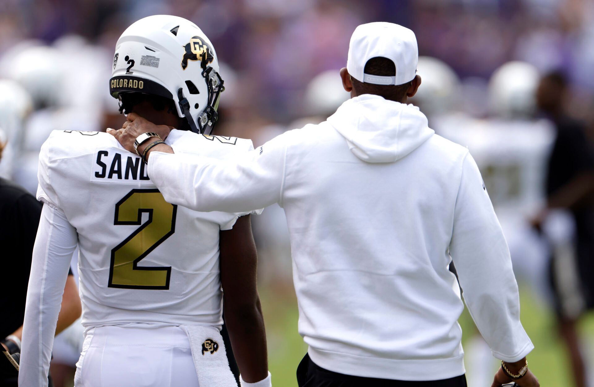 FORT WORTH, TX - SEPTEMBER 2: Shedeur Sanders #2 of the Colorado Buffaloes and his father and head coach Deion Sanders walk the sidelines just before the game against the TCU Horned Frogs at Amon G. Carter Stadium on September 2, 2023 in Fort Worth, Texas. Colorado won 45-42. (Photo by Ron Jenkins/Getty Images)