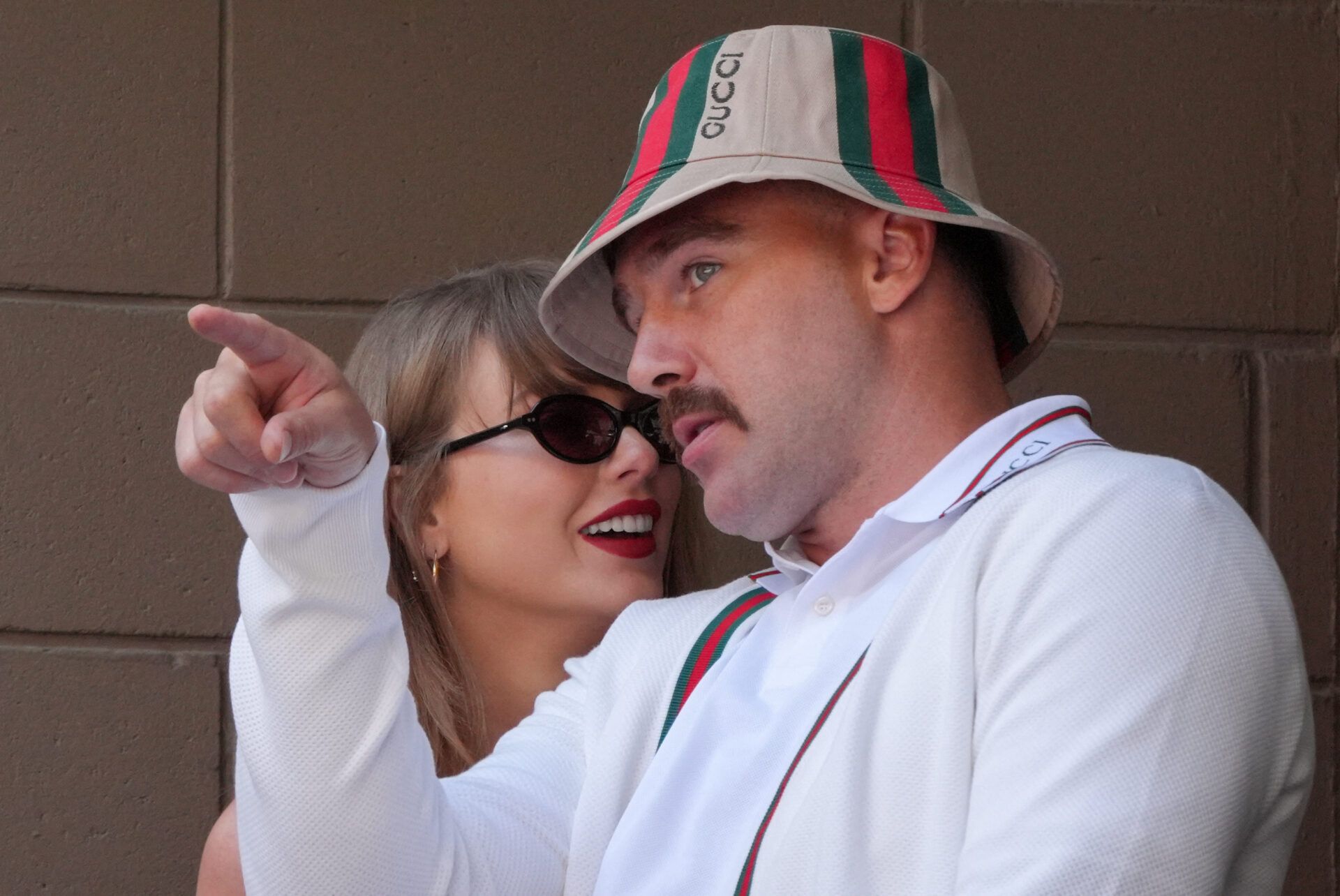 US musician Taylor Swift (L) and US NFL football player Travis Kelce (R) attend the men's final match between Italy's Jannik Sinner and USA's Taylor Fritz on day fourteen of the US Open tennis tournament at the USTA Billie Jean King National Tennis Center in New York City, on September 8, 2024. (Photo by TIMOTHY A. CLARY / AFP) (Photo by TIMOTHY A. CLARY/AFP via Getty Images)