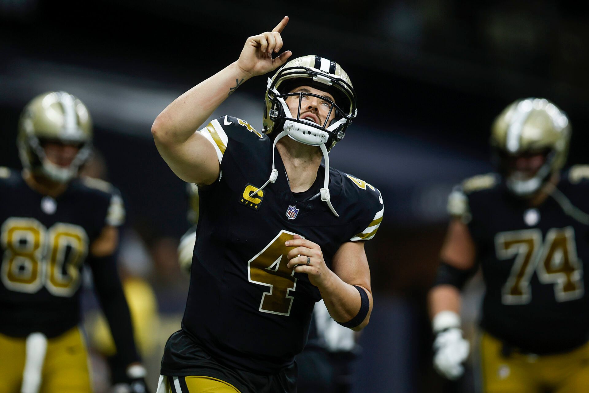 NEW ORLEANS, LOUISIANA - DECEMBER 10: Derek Carr #4 of the New Orleans Saints reacts after a touchdown during the fourth quarter against the Carolina Panthers at Caesars Superdome on December 10, 2023 in New Orleans, Louisiana. (Photo by Chris Graythen/Getty Images)