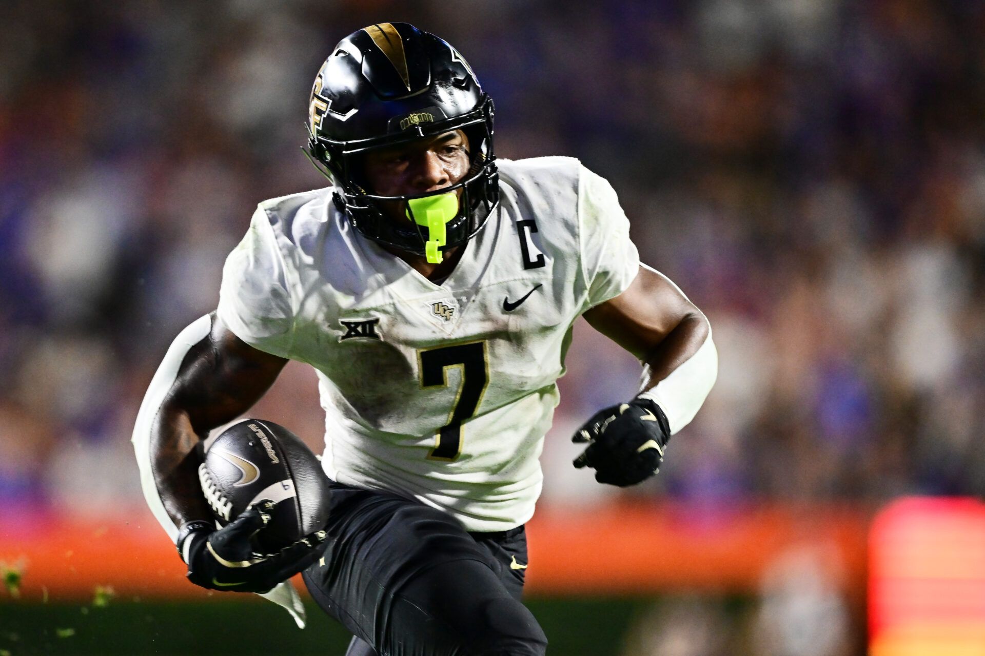 GAINESVILLE, FLORIDA - OCTOBER 05: RJ Harvey #7 of the UCF Knights rushes for a 13-yard touchdown in the fourth quarter against the Florida Gators at Ben Hill Griffin Stadium on October 05, 2024 in Gainesville, Florida. (Photo by Julio Aguilar/Getty Images)
