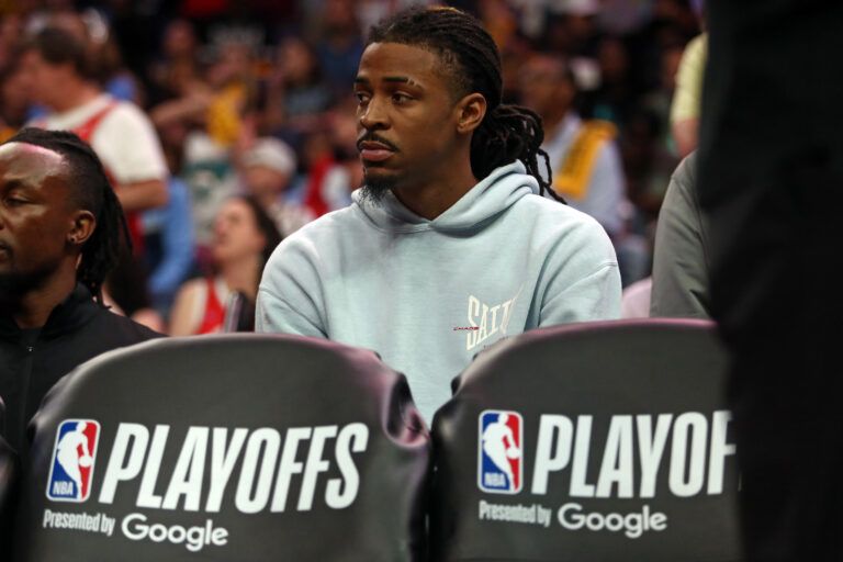 Apr 26, 2025; Memphis, Tennessee, USA; Memphis Grizzlies guard Ja Morant (12) looks on from the bench area during the fourth quarter against the Oklahoma City Thunder during game four for the first round of the 2024 NBA Playoffs at FedExForum. Mandatory Credit: Petre Thomas-Imagn Images