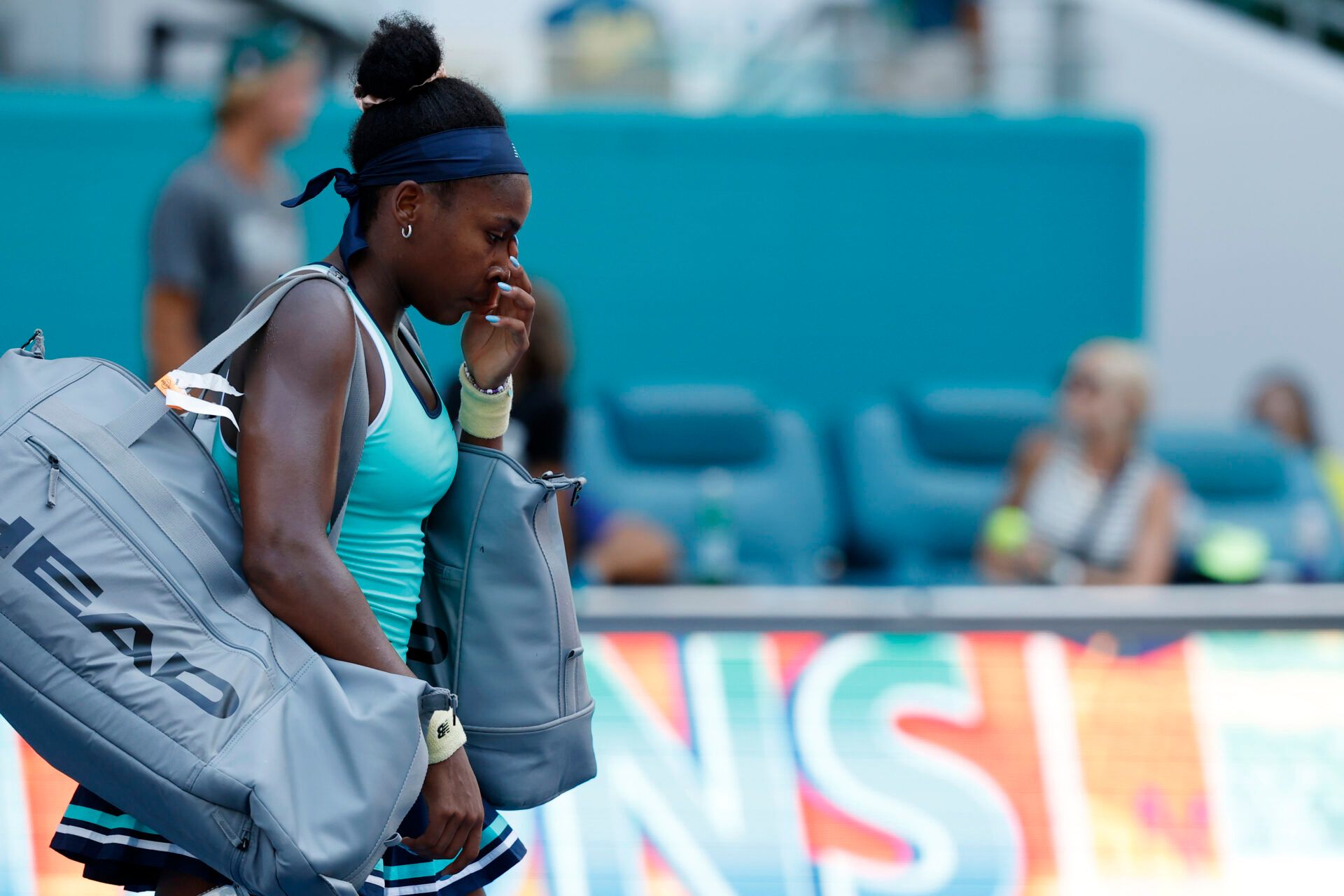 Mar 24, 2025; Miami, FL, USA; Coco Gauff (USA) wipes her eye while leaving the court after her match against Magna Linette (POL)(not pictured) on day seven of the Miami Open at Hard Rock Stadium. Mandatory Credit: Geoff Burke-Imagn Images