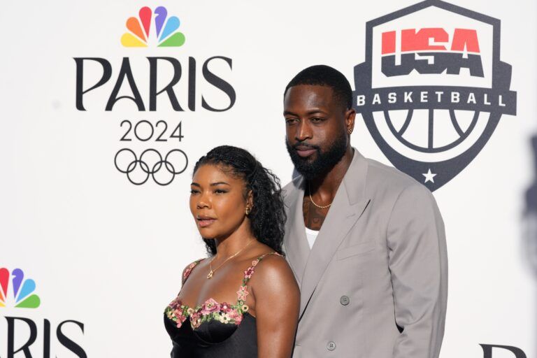 Aug 5, 2024; Paris, FRANCE; Dwyane Wade and wife Gabrielle Union pose for a photograph during the Paris 2024 Olympic Summer Games at Team USA House. Mandatory Credit: John David Mercer-USA TODAY Sports