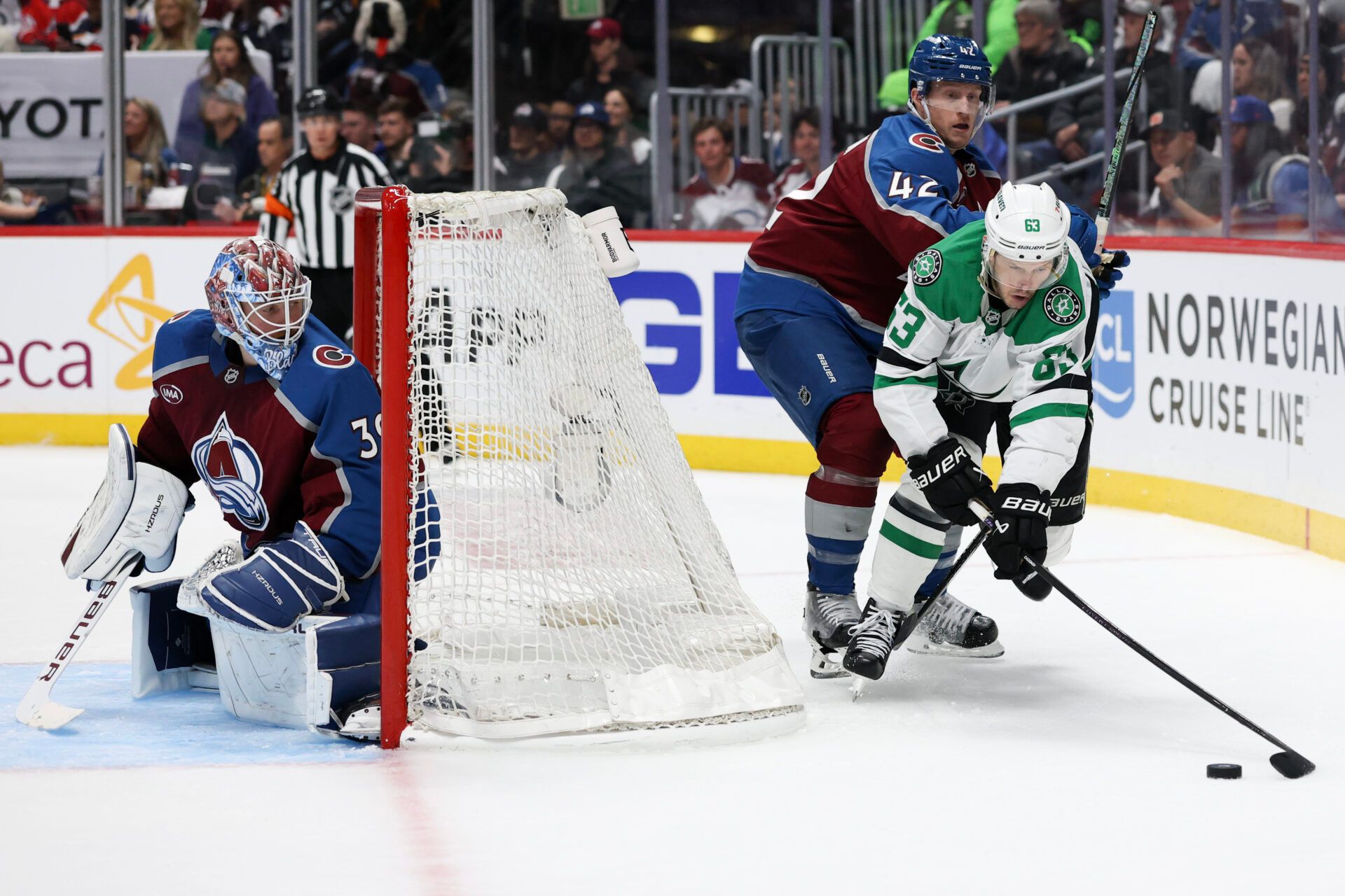 DENVER, COLORADO - APRIL 26: Mackenzie Blackwood #39 of the Colorado Avalanche watches as Josh Manson #42 defends Evgenii Dadonov #63 of the Dallas Stars during the third period in Game Four of the First Round of the 2025 Stanley Cup Playoffs at Ball Arena on April 26, 2025 in Denver, Colorado. (Photo by Matthew Stockman/Getty Images)