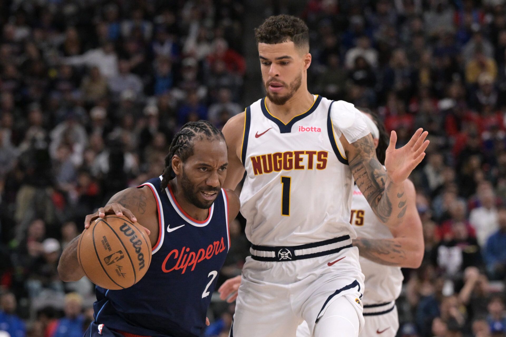 Apr 26, 2025; Inglewood, California, USA; Los Angeles Clippers forward Kawhi Leonard (2) is defended by Denver Nuggets forward Michael Porter Jr. (1) in the second half of game four of round one of the 2024 NBA Playoffs at Intuit Dome. Mandatory Credit: Jayne Kamin-Oncea-Imagn Images