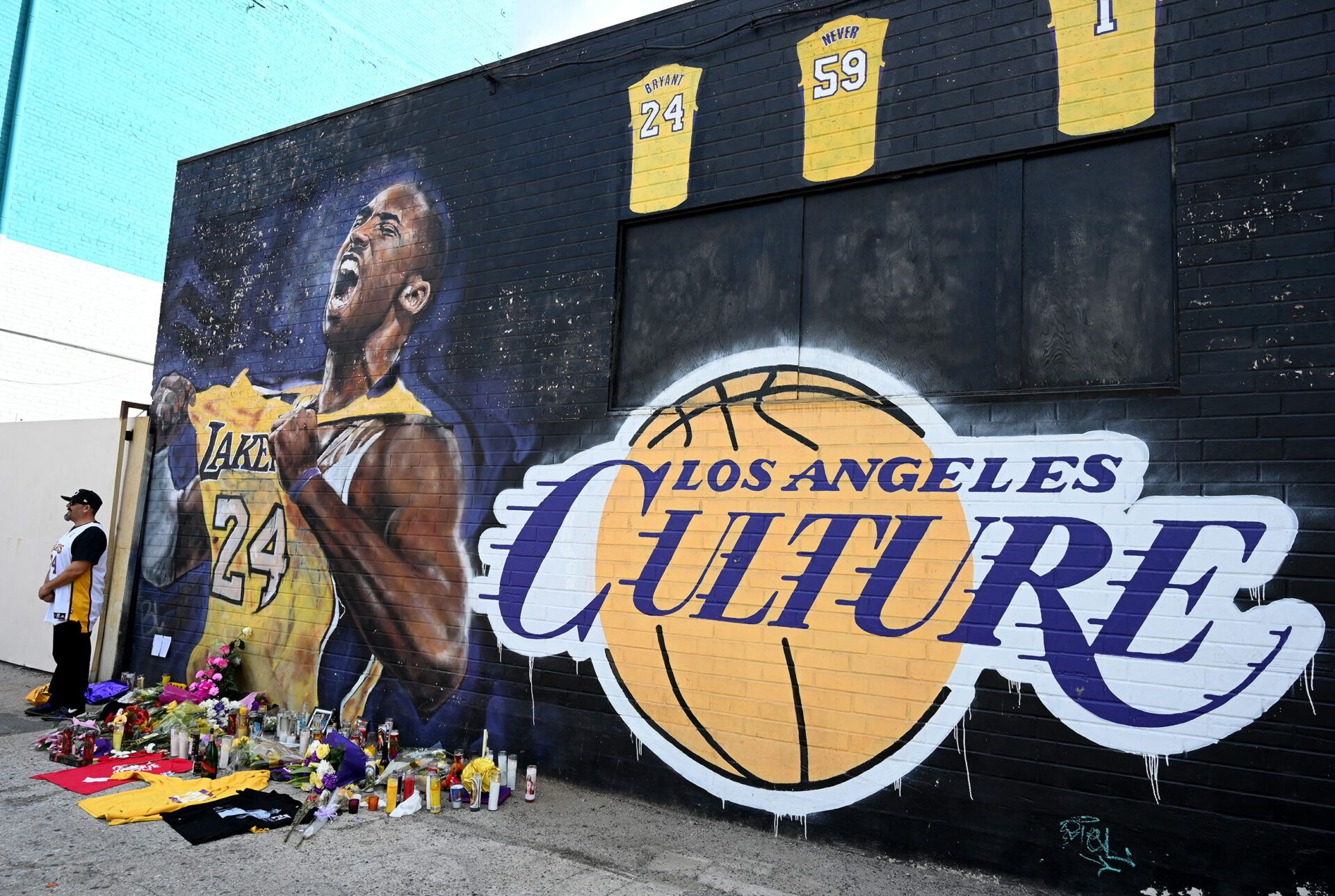 Jan 27, 2020; Los Angeles, California, USA; Fans gather at a mural painted in an alley on Lebanon St in Los Angeles pays tribute to Kobe Bryant who was killed in a helicopter crash Jan 26, 2020. Mandatory Credit: Jayne Kamin-Oncea-USA TODAY Sports