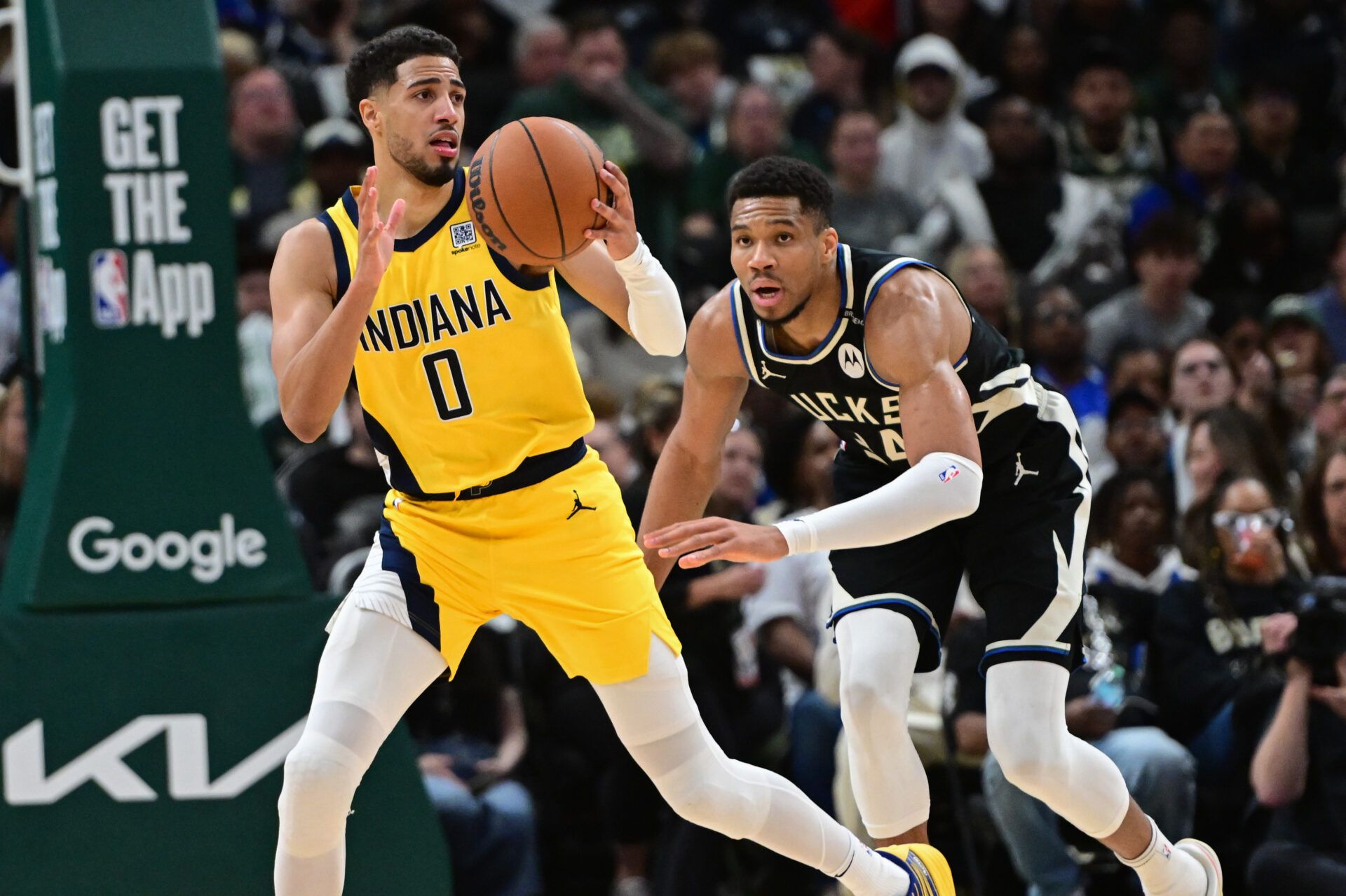 Apr 27, 2025; Milwaukee, Wisconsin, USA; Indiana Pacers guard Tyrese Haliburton (0) looks for a shot against Milwaukee Bucks forward Giannis Antetokounmpo (34) in the third quarter during game four of first round for the 2024 NBA Playoffs at Fiserv Forum. Mandatory Credit: Benny Sieu-Imagn Images