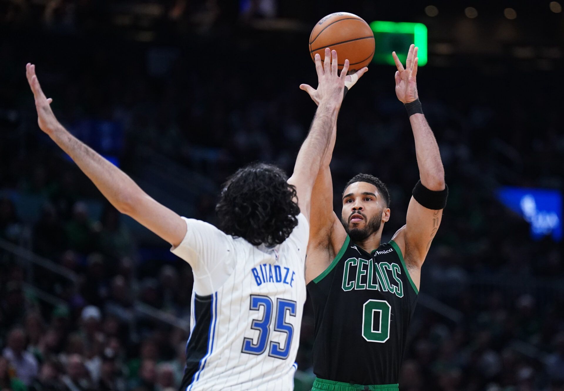 Apr 29, 2025; Boston, Massachusetts, USA; Boston Celtics forward Jayson Tatum (0) shoots the ball against Orlando Magic center Goga Bitadze (35) in the third quarter during game five of first round for the 2025 NBA Playoffs at TD Garden. Mandatory Credit: David Butler II-Imagn Images