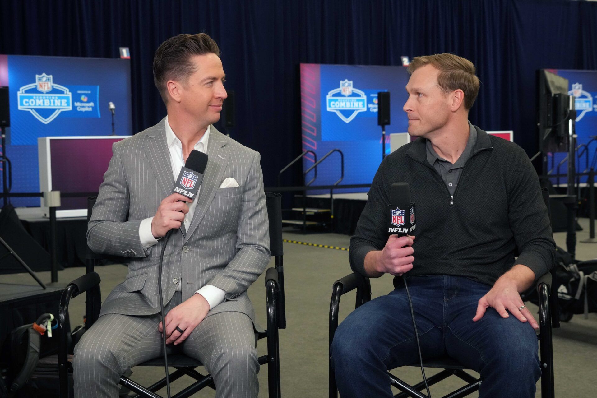 Feb 25, 2025; Indianapolis, IN, USA; NFL Network reporter Tom Pelissero (left) interviews Chicago Bears coach Ben Johnson during the NFL Scouting Combine at the Indiana Convention Center. Mandatory Credit: Kirby Lee-Imagn Images