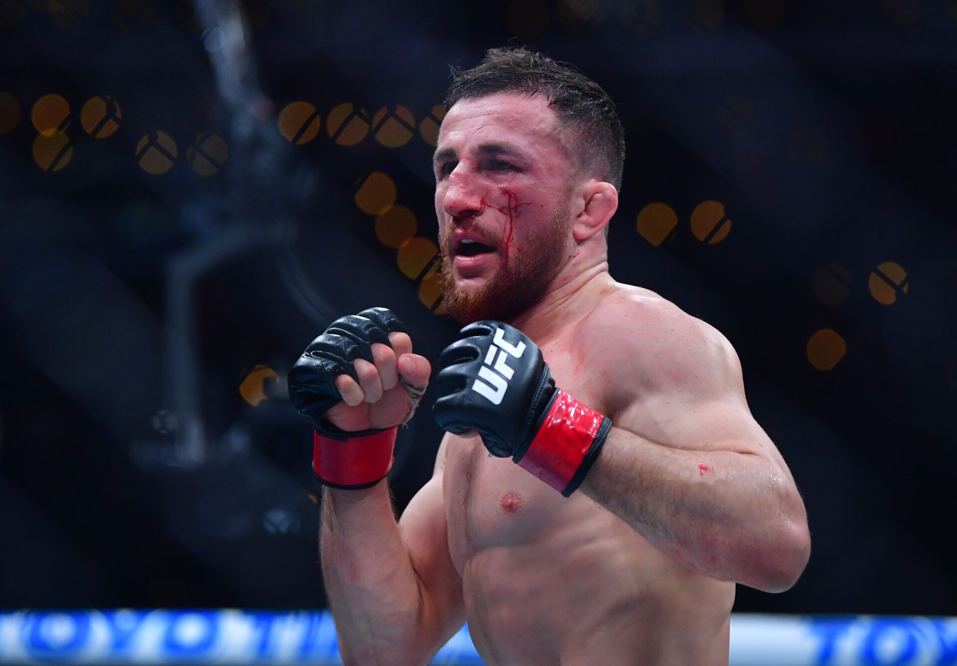 Jan 18, 2025; Inglewood, California, USA; Merab Dvalishvili (red gloves) fights Umar Nurmagomedov (not pictured) during UFC 311 at Intuit Dome. Mandatory Credit: Gary A. Vasquez-Imagn Images