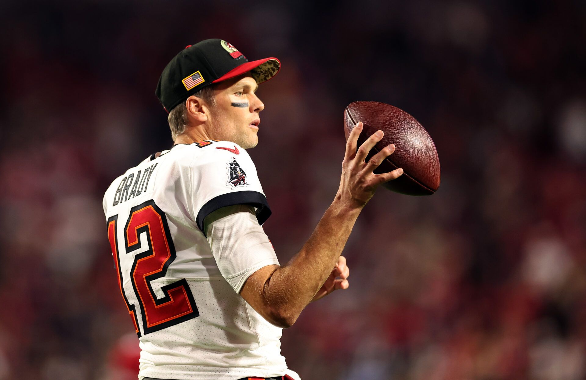 GLENDALE, ARIZONA - DECEMBER 25: Tom Brady #12 of the Tampa Bay Buccaneers warms up prior to the game against the Arizona Cardinals at State Farm Stadium on December 25, 2022 in Glendale, Arizona. (Photo by Christian Petersen/Getty Images)