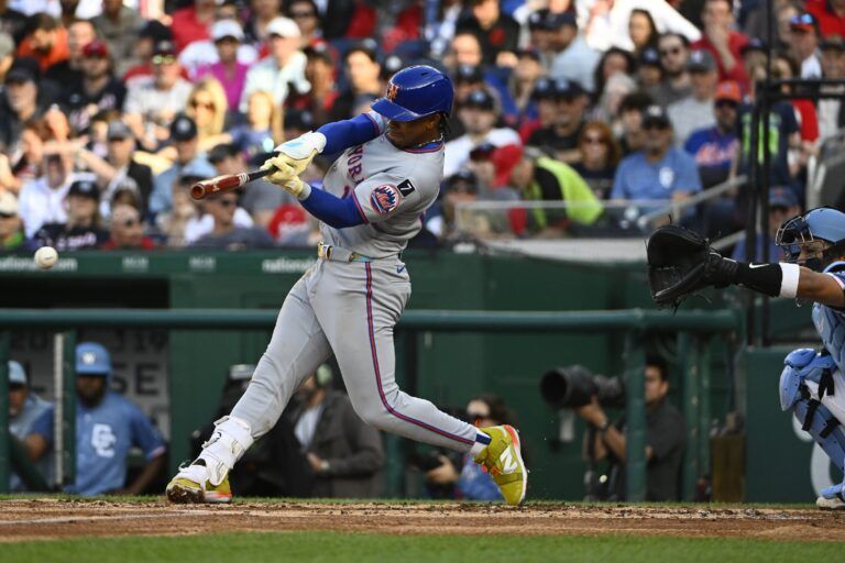 New York Mets shortstop Francisco Lindor (12) singles against the Washington Nationals during the third inning at Nationals Park