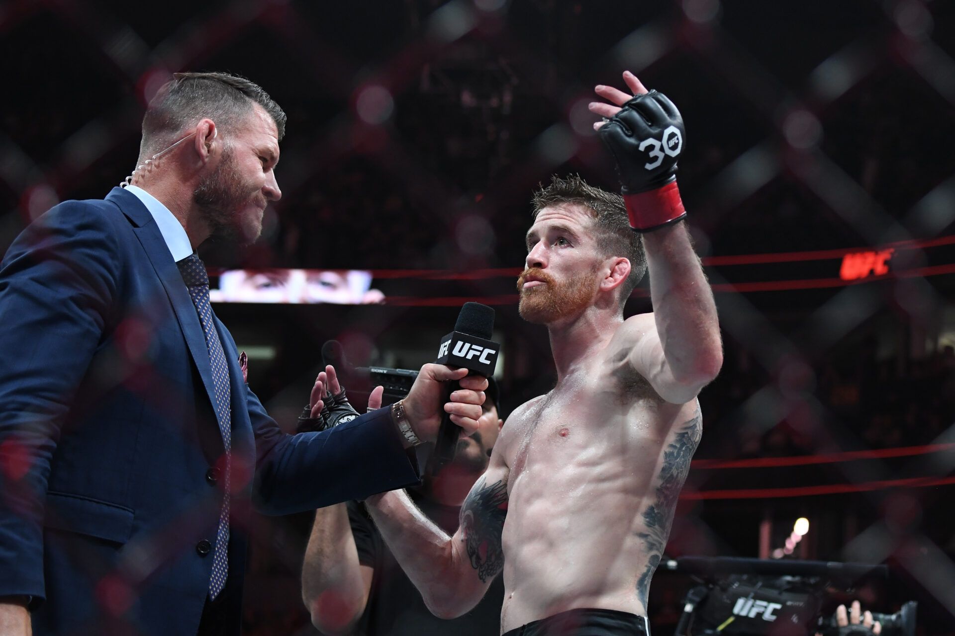 Aug 5, 2023; Nashville, Tennessee, USA; Cory Sandhagen (red gloves) celebrates the win over Rob Font (not pictured) during UFC Fight Night at Bridgestone Arena. Mandatory Credit: Christopher Hanewinckel-USA TODAY Sports