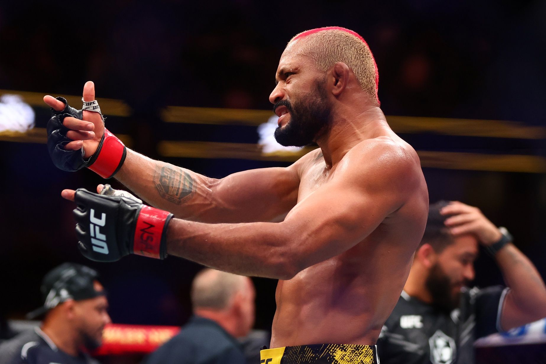 Deiveson Figueiredo (red gloves) reacts after defeating Cody Garbrandt (not pictured) during UFC 300 at T-Mobile Arena.