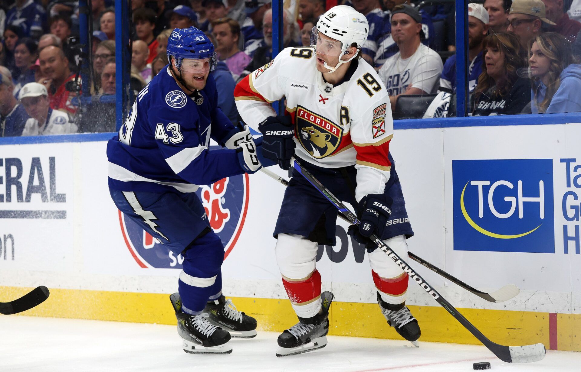 Apr 22, 2025; Tampa, Florida, USA; Florida Panthers left wing Matthew Tkachuk (19) skates with the puck as Tampa Bay Lightning defenseman Darren Raddysh (43) defends during the second period in game one of the first round of the 2025 Stanley Cup Playoffs at Amalie Arena. Mandatory Credit: Kim Klement Neitzel-Imagn Images