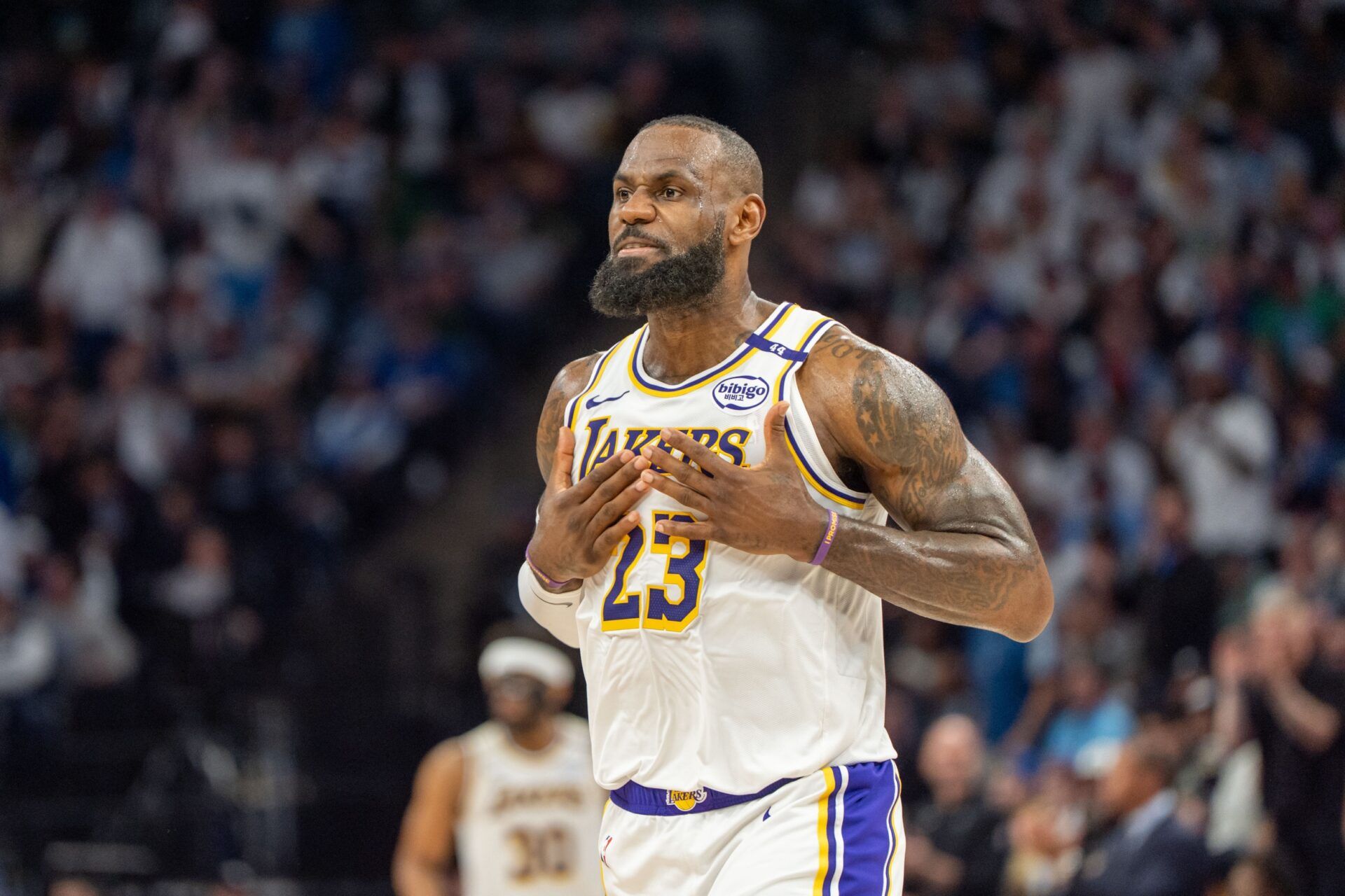 Apr 27, 2025; Minneapolis, Minnesota, USA; Los Angeles Lakers forward LeBron James (23) talks with his coach during a stoppage in play against the Minnesota Timberwolves in the second quarter during game four of first round for the 2025 NBA Playoffs at Target Center. Mandatory Credit: Matt Blewett-Imagn Images