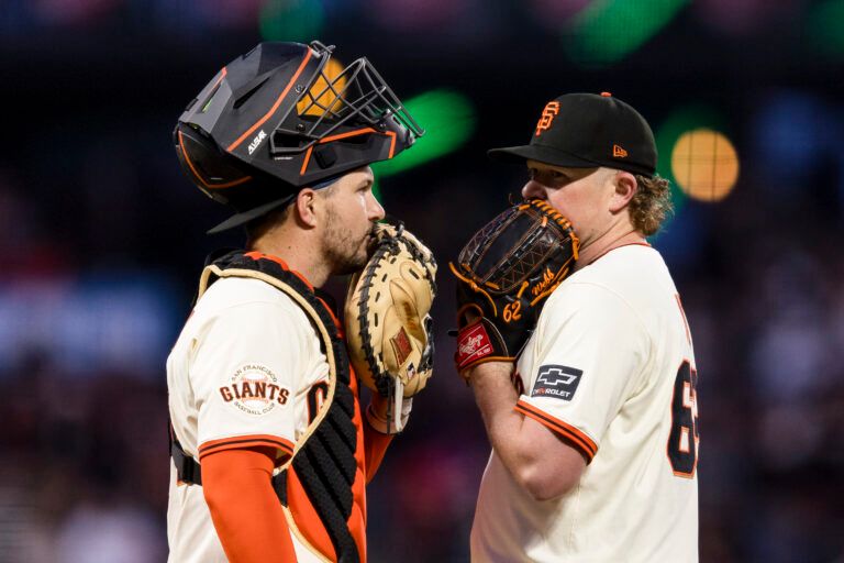 Apr 7, 2025; San Francisco, California, USA; San Francisco Giants catcher Patrick Bailey (14) and starting pitcher Logan Webb (62) talk before the pitch against the Cincinnati Reds during the fifth inning at Oracle Park. Mandatory Credit: John Hefti-Imagn Images