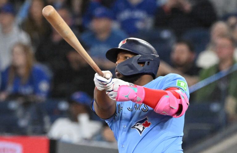 Toronto Blue Jays first baseman Vladimir Guerrero Jr. (27) hits a three run home run against the Boston Red Sox in the eighth inning at Rogers Centre.
