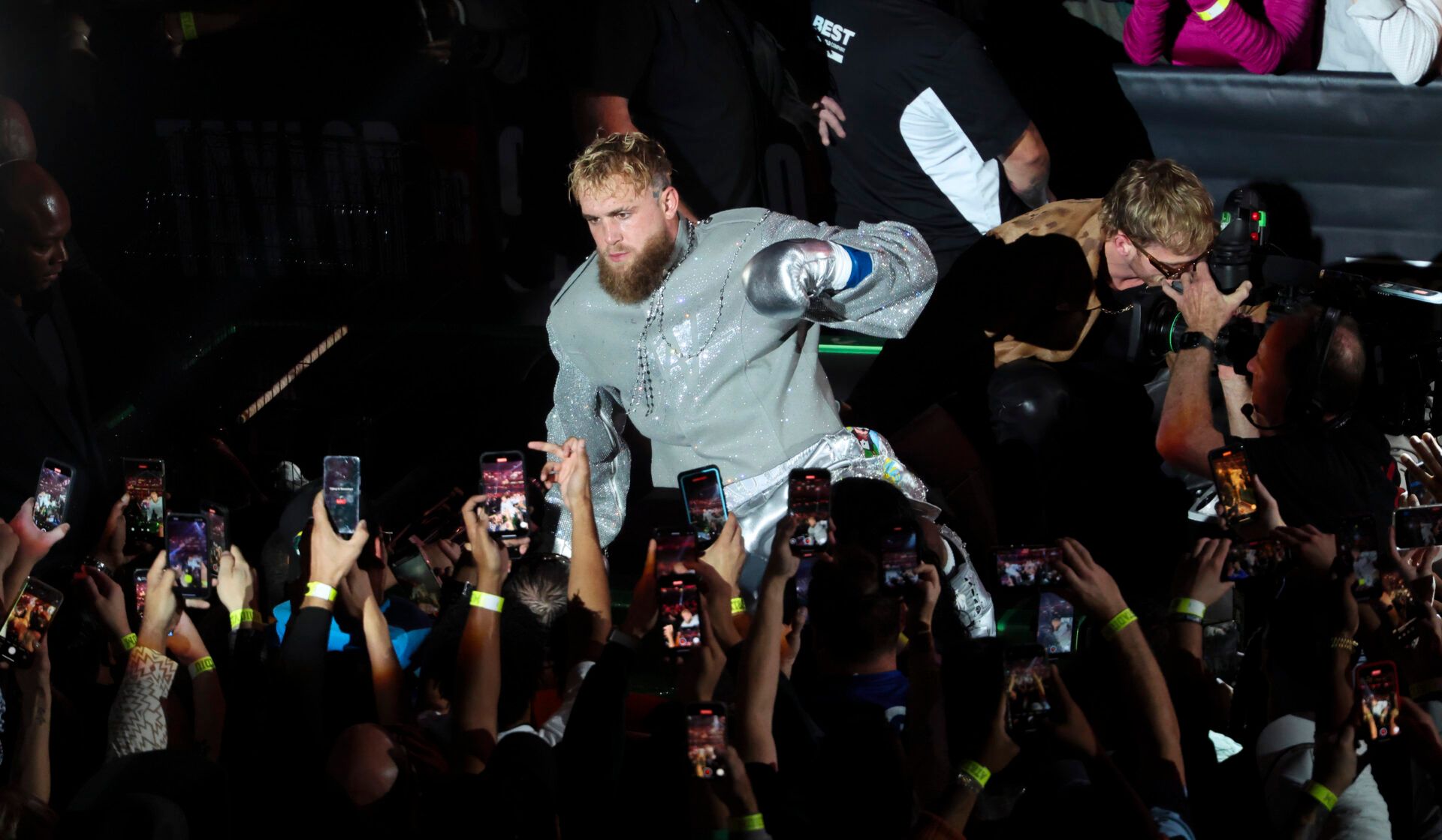 Nov 15, 2024; Arlington, Texas, UNITED STATES; Jake Paul and his brother Logan ride to the ring in a car before the fight against Mike Tyson at AT&T Stadium. Mandatory Credit: Kevin Jairaj-Imagn Images