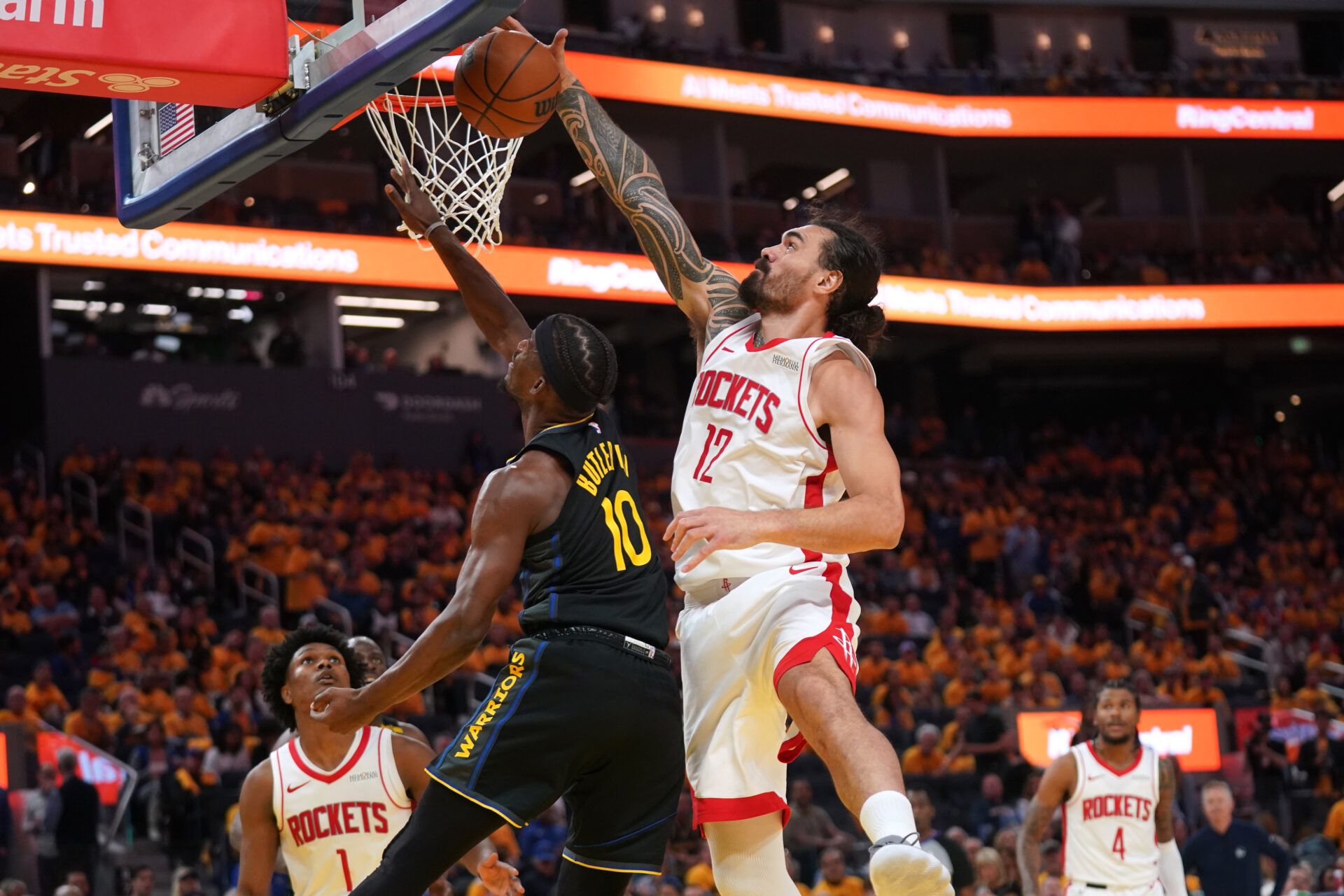 May 2, 2025; San Francisco, California, USA; Golden State Warriors forward Jimmy Butler III (10) has his shot blocked by Houston Rockets center Steven Adams (12) in the third quarter of game six of the first round for the 2025 NBA Playoffs at Chase Center. Mandatory Credit: Cary Edmondson-Imagn Images