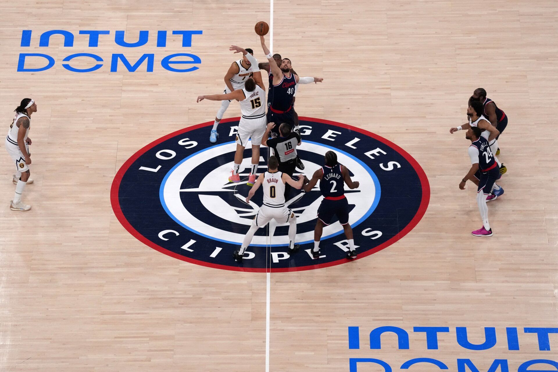 A general overall view of the opening tipoff between Denver Nuggets center Nikola Jokic (15) and LA Clippers center Ivica Zubac (40) during game six of first round for the 2025 NBA Playoffs at Intuit Dome.
