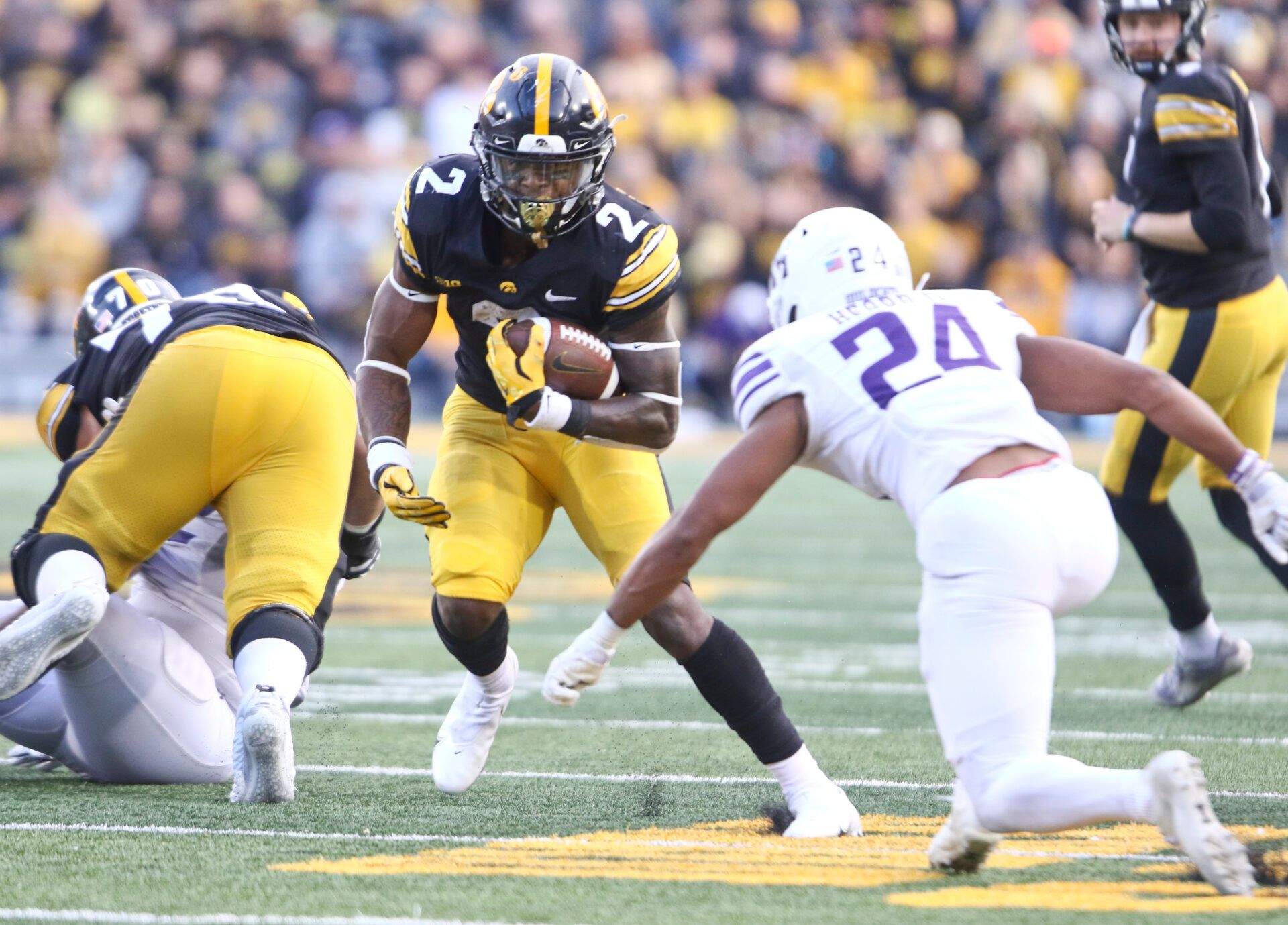 IOWA CITY, IOWA- OCTOBER 29: Running back Kaleb Johnson #2 of the Iowa Hawkeyes goes up the field during the second half in front of defensive back Rod Heard II #24 of the Northwestern Wildcats at Kinnick Stadium, on October 29, 2022 in Iowa City, Iowa. (Photo by Matthew Holst/Getty Images)