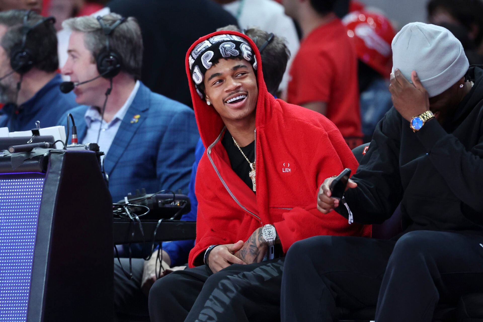 Mar 3, 2025; Houston, Texas, USA; Houston Texans wide receiver Tank Dell smiles before the game between the Houston Cougars and the Kansas Jayhawks at Fertitta Center. Mandatory Credit: Troy Taormina-Imagn Images