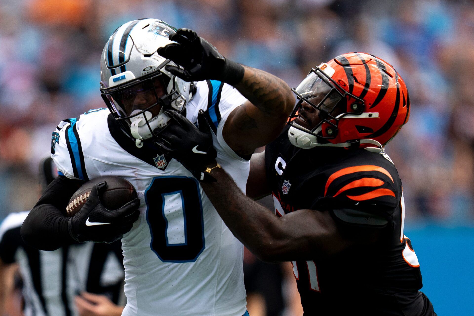 Carolina Panthers tight end Ja'Tavion Sanders (0) is tackled by Cincinnati Bengals linebacker Germaine Pratt (57) in the second quarter of the NFL game at Bank of America Stadium in Charlotte, N.C., on Sunday, Sept. 29, 2024.