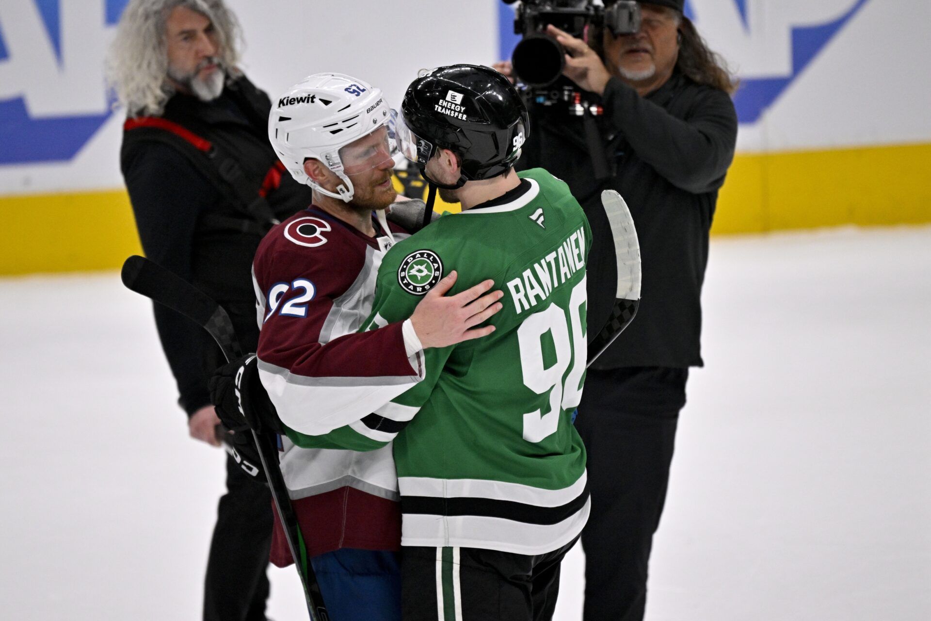 Colorado Avalanche left wing Gabriel Landeskog (92) hugs Dallas Stars right wing Mikko Rantanen (96) after the Stars defeats the Avalanche in game seven of the first round of the 2025 Stanley Cup Playoffs at American Airlines Center.