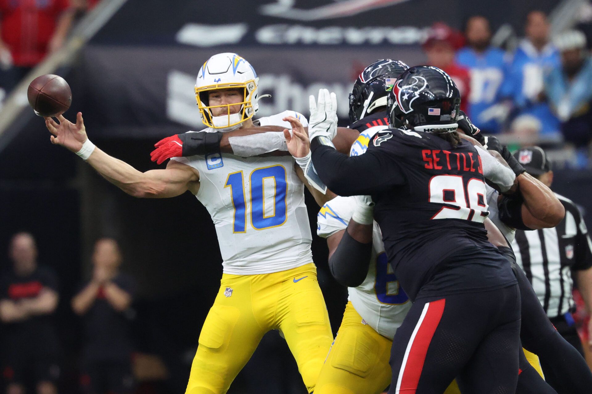 Jan 11, 2025; Houston, Texas, USA; Los Angeles Chargers quarterback Justin Herbert (10) passes during the second quarter against the Houston Texans in an AFC wild card game at NRG Stadium. Mandatory Credit: Troy Taormina-Imagn Images