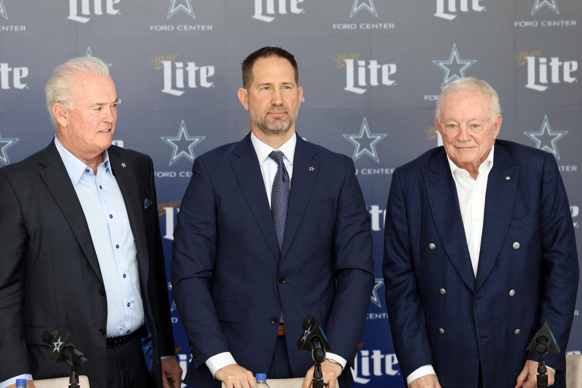 Jan 27, 2025; Frisco, TX, USA; (L to R) Dallas Cowboys CEO Stephen Jones,head coach Brian Schottenheimer and owner Jerry Jones pose for pictures after a press conference at the Star. Mandatory Credit: Tim Heitman-Imagn Images
