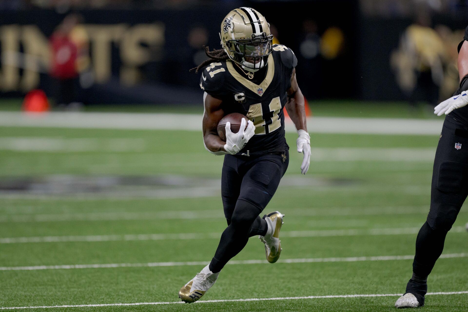 New Orleans Saints running back Alvin Kamara (41) runs against the Los Angeles Rams during the first half at Caesars Superdome.