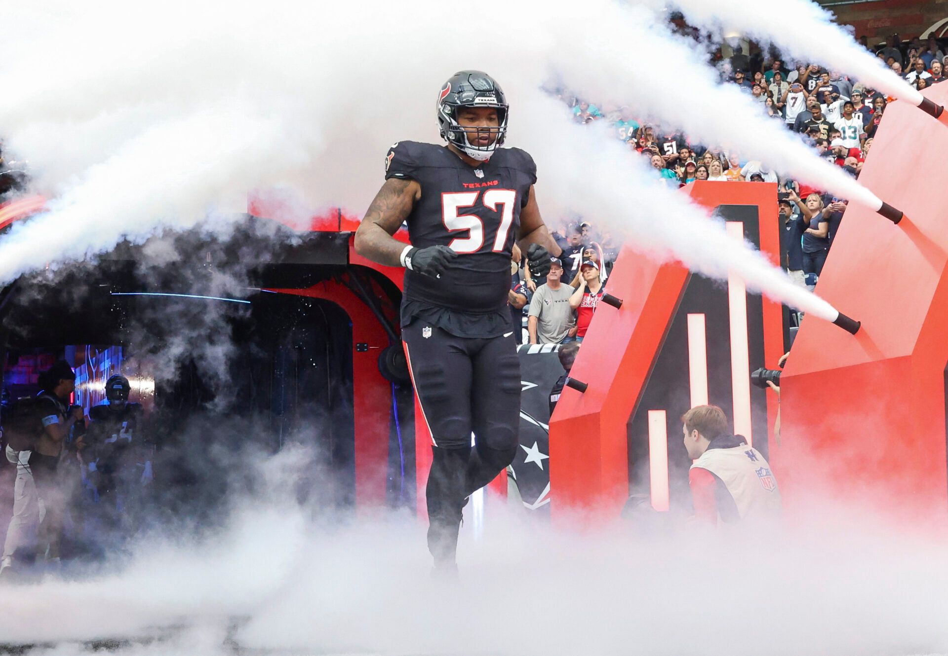 Dec 15, 2024; Houston Texans offensive tackle Blake Fisher (57) runs onto the field before the game against the Miami Dolphins at NRG Stadium.