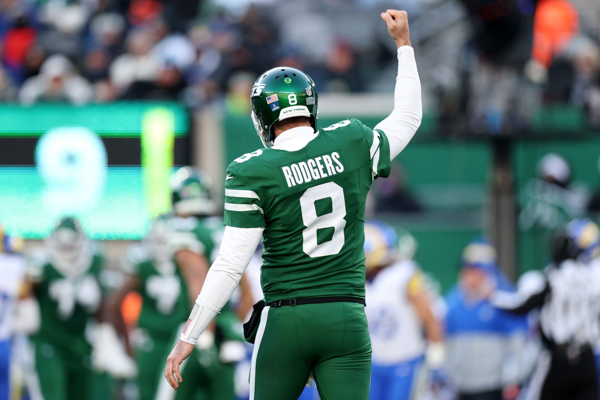 EAST RUTHERFORD, NEW JERSEY - DECEMBER 22: Aaron Rodgers #8 of the New York Jets reacts during a game against the Los Angeles Rams at MetLife Stadium on December 22, 2024 in East Rutherford, New Jersey. (Photo by Emilee Chinn/Getty Images)