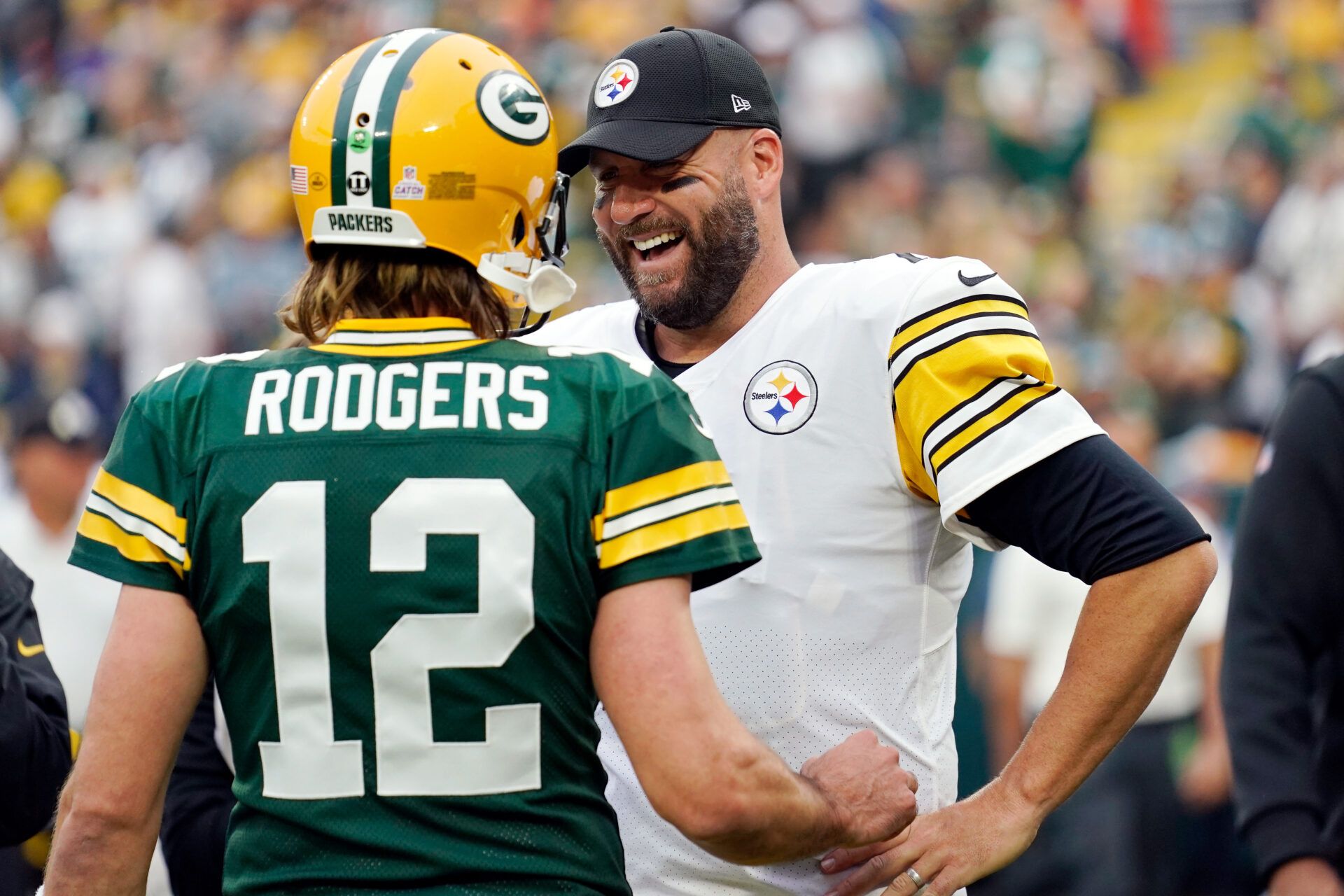GREEN BAY, WISCONSIN - OCTOBER 03: Aaron Rodgers #12 of the Green Bay Packers talks with Ben Roethlisberger #7 of the Pittsburgh Steelers before the game at Lambeau Field on October 03, 2021 in Green Bay, Wisconsin. (Photo by Patrick McDermott/Getty Images)