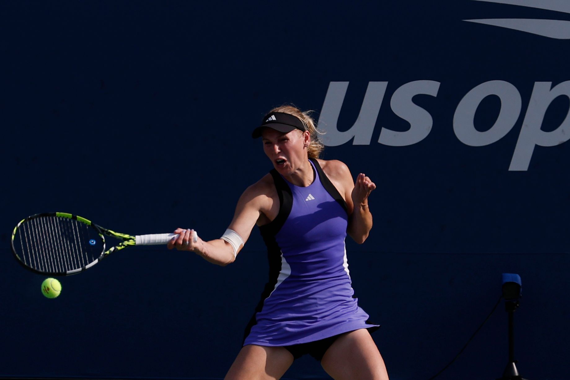 Aug 31, 2024; Flushing, NY, USA; Caroline Wozniacki (DEN) hits a forehand against Jessika Ponchet (FRA)(not pictured) in a women's singles match on day six of the 2024 U.S. Open tennis tournament at USTA Billie Jean King National Tennis Center. Mandatory Credit: Geoff Burke-USA TODAY Sports